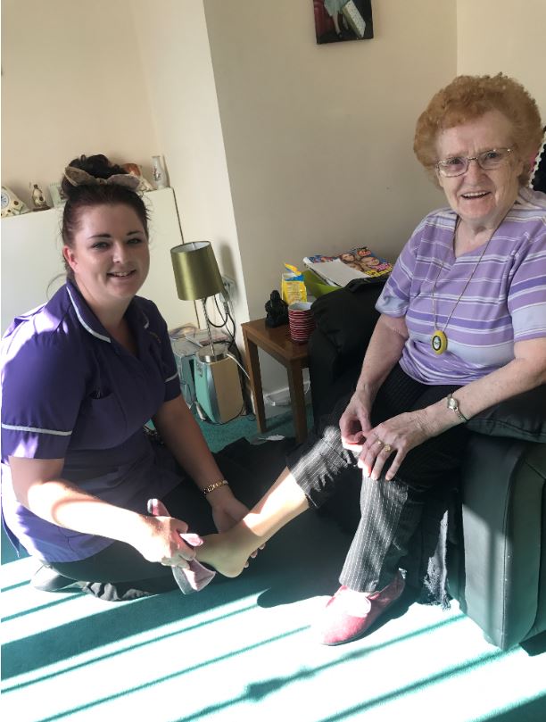 a carer assisting a resident