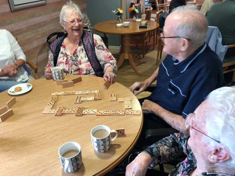 residents playing dominoes