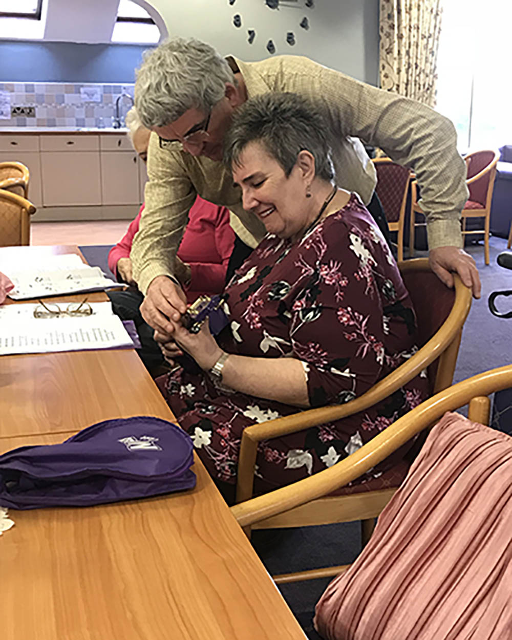 a resident learning ukulele