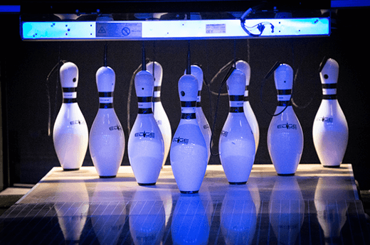 a view down the bowling alley of the pins