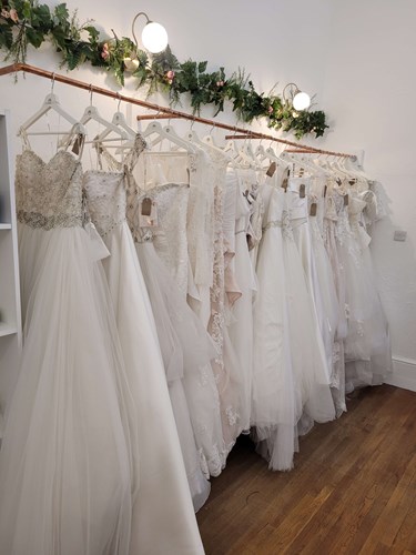 Photo of wedding dresses on a rail