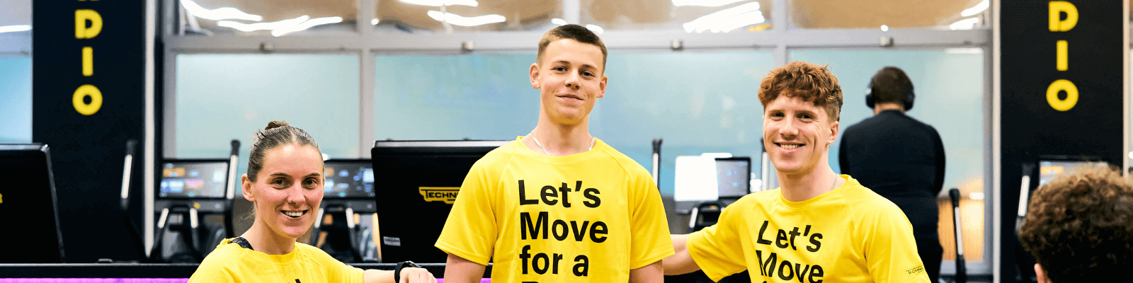 3 people in yellow lets move for a better world t-shirts