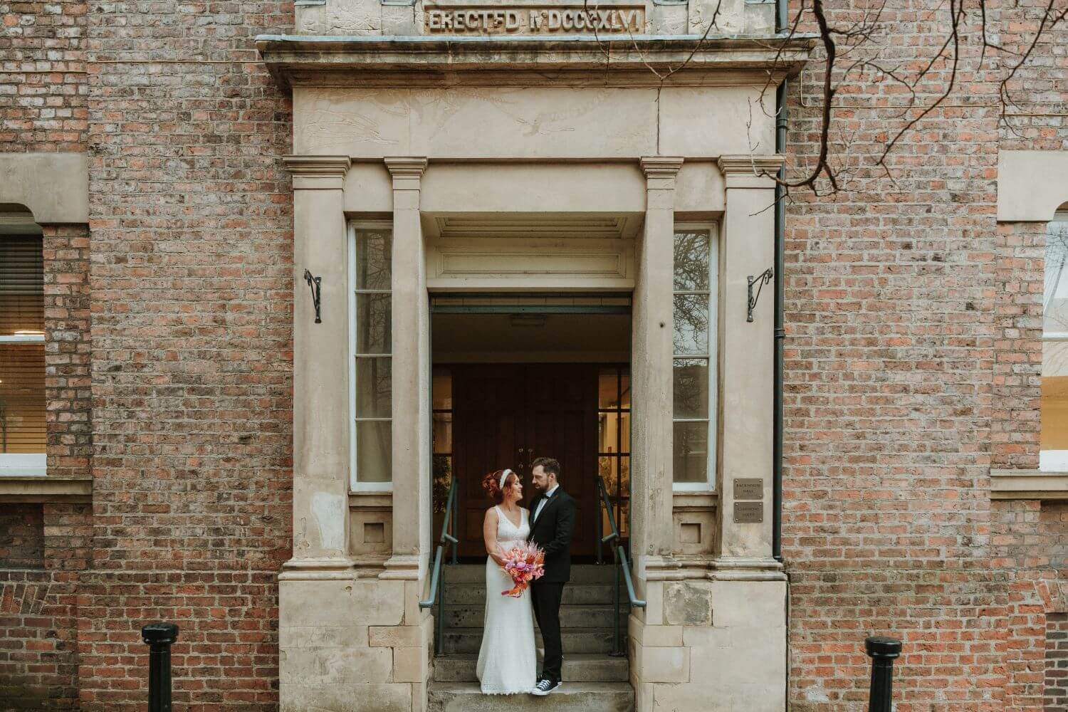 happy couple outside register office<span class=