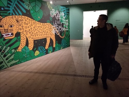Man at an art exhibition