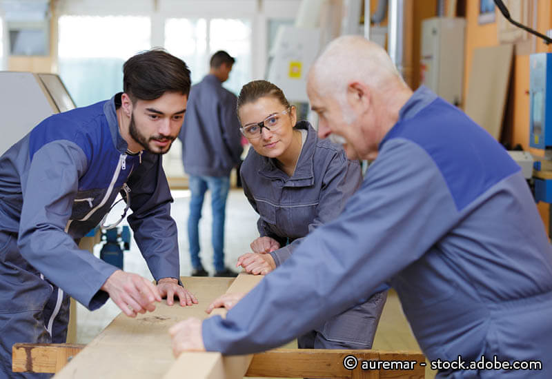Apprentices taking part in a woodwork class