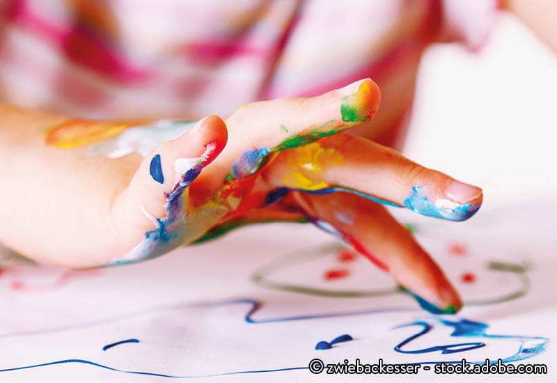 A child finger-painting
