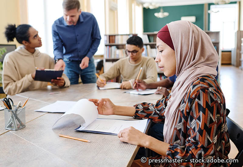 A group of learners sat around a table