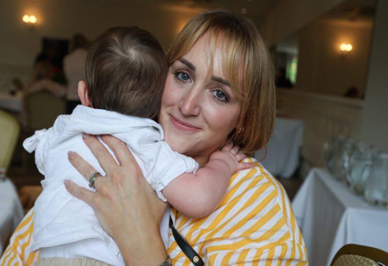 adult cuddling baby