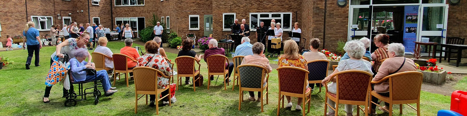 residents listening to a musical performance