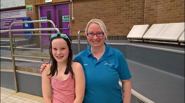 Sarah-Jayne Sams working as a swimming instructor